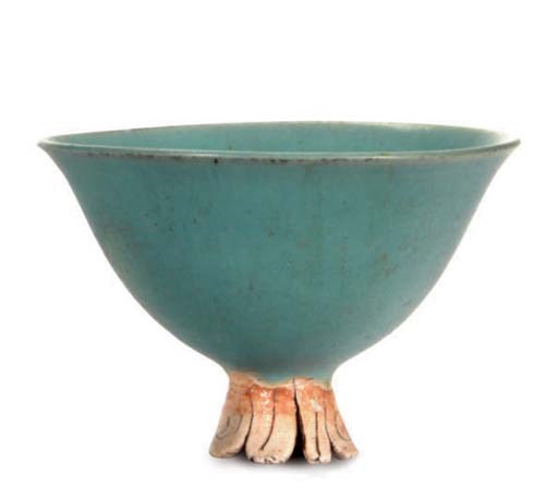 AN AMERICAN IRRIDENSCENT BLUE GLAZED STONEWARE FOOTED BOWL,