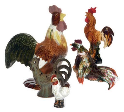 A GROUP OF CONTINENTAL CERAMIC FIGURES OF ROOSTERS AND TWO OVAL PAINTED PLAQUES,