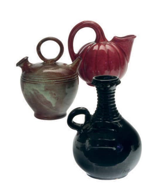 THREE CONTINENTAL GLAZED CERAMIC PITCHERS AND TWO TWO-HANDLED VASES,