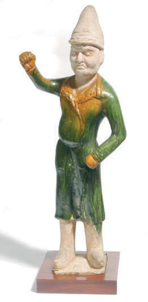 A CHINESE SANCAI-GLAZED MODEL OF A FOREIGN GROOM,