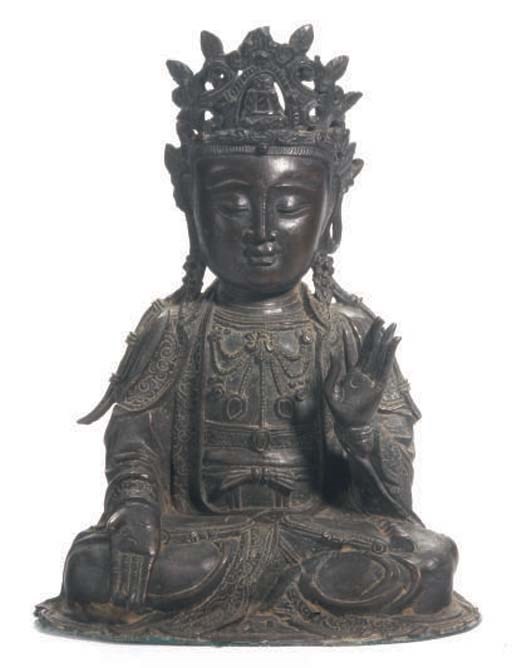 A CHINESE BRONZE MODEL OF GUANYIN,