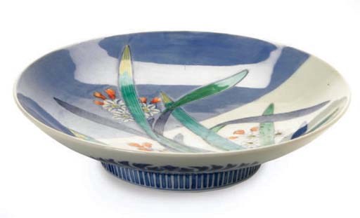 A JAPANESE BLUE AND WHITE NABESHIMA WARE DISH AND ANOTHER DISH PAINTED WITH HORSES,