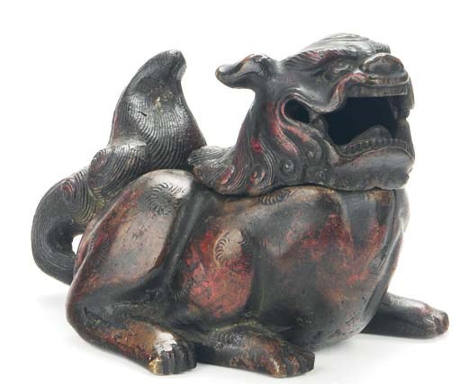 A JAPANESE PATINATED BRONZE LION-FORM CENSER AND COVER,