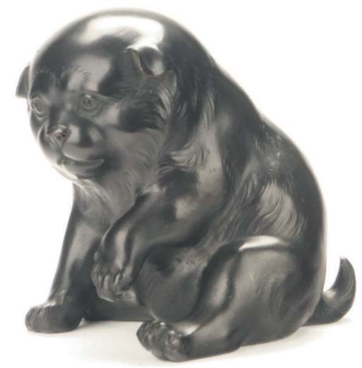 A JAPANESE BRONZE MODEL OF A YOUNG DOG,