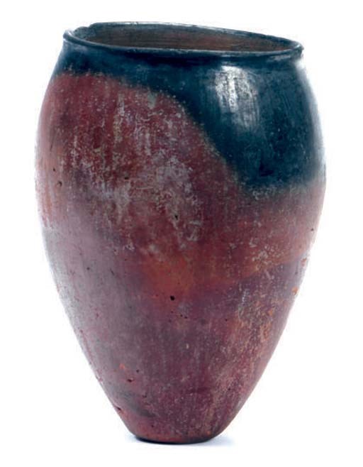 AN EGYPTIAN BLACK TOPPED POTTERY JAR,