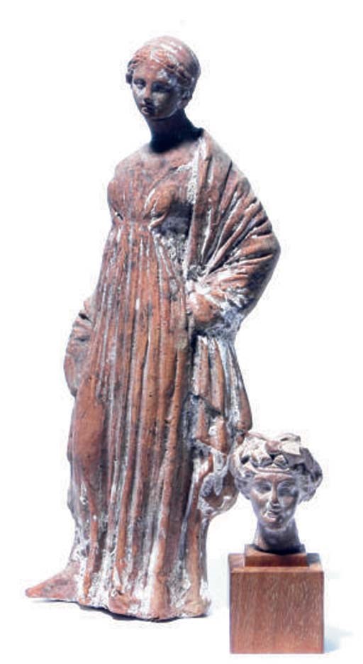 A GREEK TERRACOTTA FEMALE FIGURE,