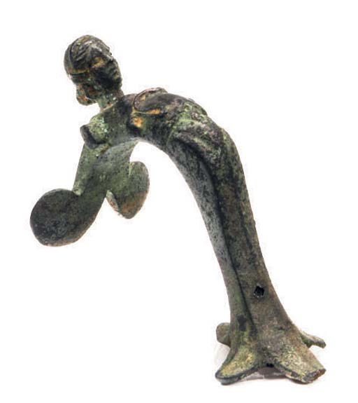 A ROMAN BRONZE VESSEL HANDLE MODELED AS A GODDESS,