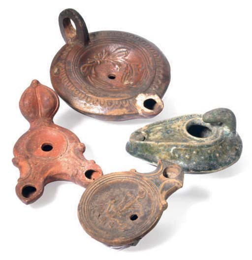 FOUR ROMAN TERRACOTTA OIL LAMPS,