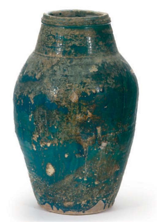AN ISLAMIC POTTERY STORAGE VESSEL,