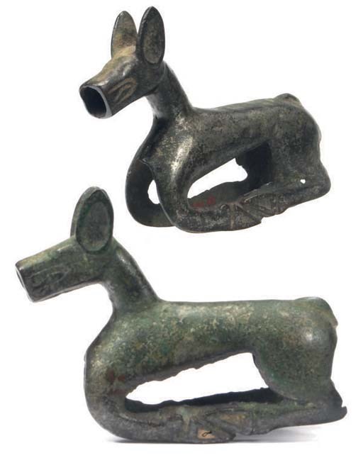 A SINO-SIBERIAN BRONZE RECUMBENT DEER,