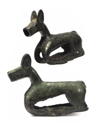 A SINO-SIBERIAN BRONZE RECUMBENT DEER,