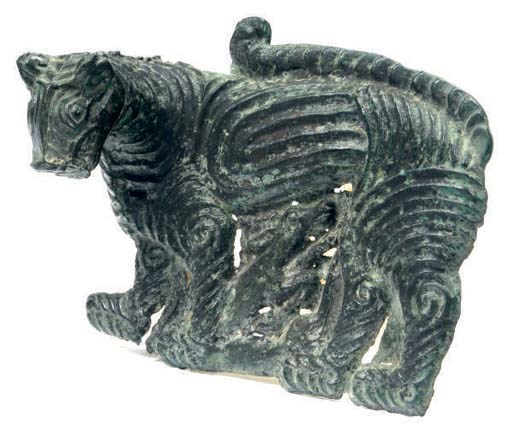 A SINO-SIBERIAN BRONZE PLAQUE WITH A TIGER,