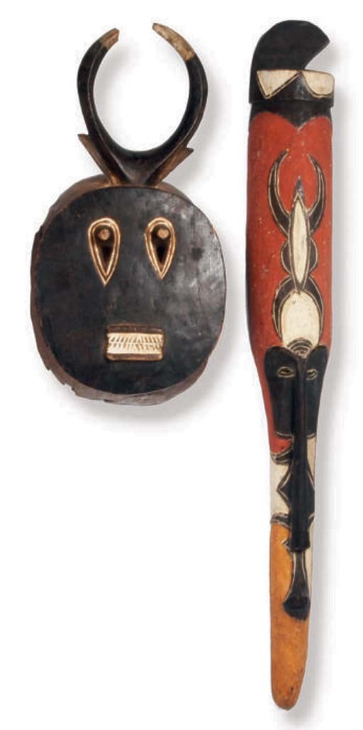 A GROUP OF FOUR AFRICAN STYLE DECORATIVE MASKS,