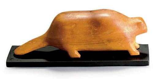 AN EASTERN WOODLANDS CARVED WOOD SCULPTURE OF A BEAVER,