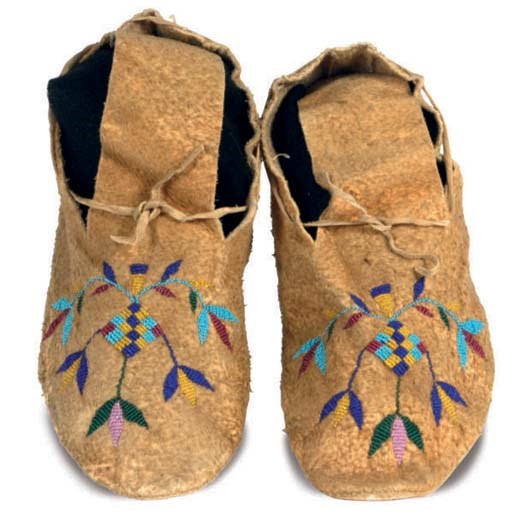 A PAIR OF SIOUX BEADED HIDE MOCCASINS