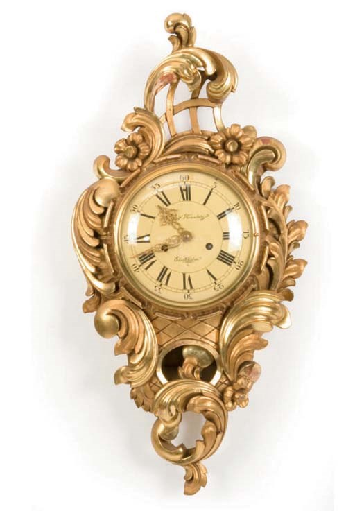 A SWEDISH GILTWOOD CARTEL CLOCK,