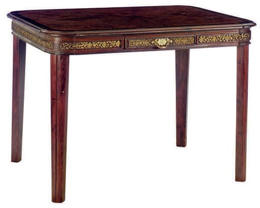 AN ART DECO PARCEL-GILT MAHOGANY AND WALNUT CENTER TABLE,