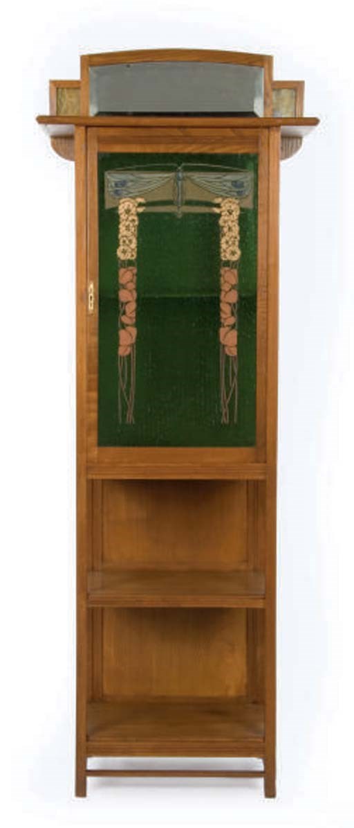 AN AUSTRIAN SECESSIONIST MOVEMENT WALNUT AND STAINED GLASS TALL CABINET WITH MIRROR,