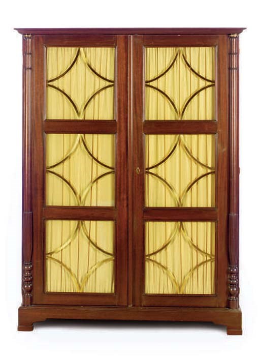 A FRENCH BRASS-MOUNTED MAHOGANY TWO DOOR AMOIRE,