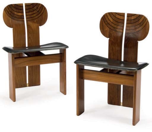 A SET OF FOUR WALNUT AND EBONISED 'AFRICA' CHAIRS,