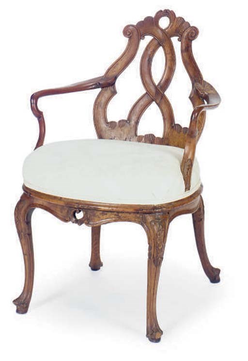 A PAIR OF ITALIAN CARVED WALNUT ARMCHAIRS,