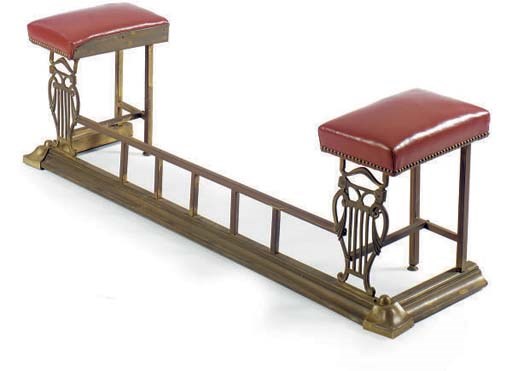 A VICTORIAN BRASS FIRE FENDER,