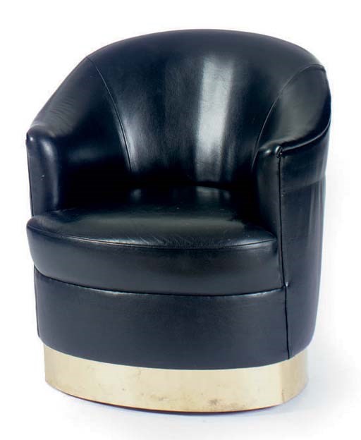 A BLACK LEATHER AND POLISHED BRASS BASE CLUB CHAIR,