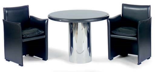 A BLACK GRANITE AND CHROME CENTER TABLE WITH FOUR LEATHER CHAIRS,