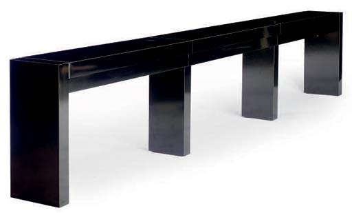 A CONTEMPORARY BLACK LAMINATE AND CHROME CONSOLE TABLE,