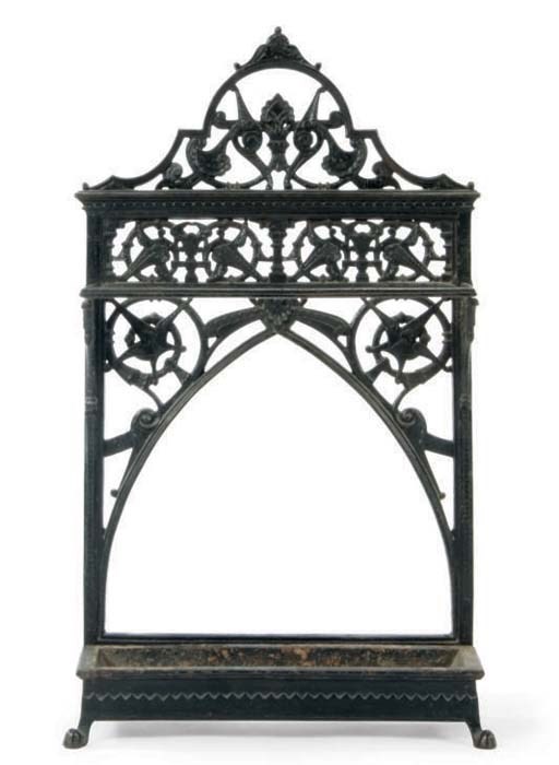 AN IRON UMBRELLA STAND AND DRIP TRAY,