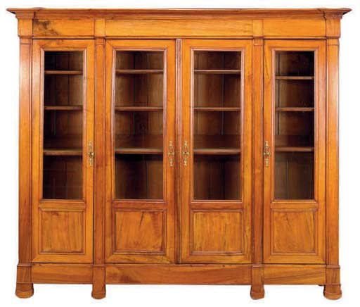 A NORTH EUROPEAN CARVED WALNUT BOOKCASE,