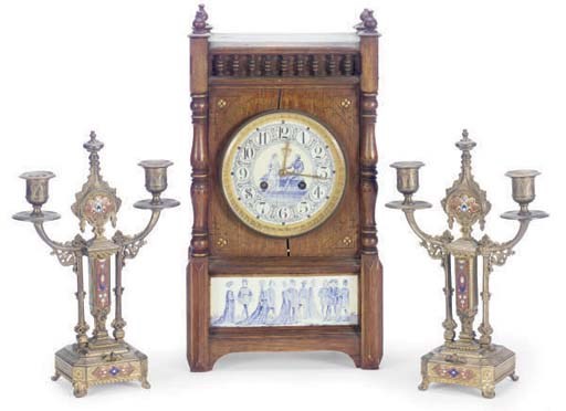 A BLUE AND WHITE TILE INSET CARVED WALNUT CLOCK TOGETHER WITH A PAIR OF GILT-METAL AND CLOISONNE CANDELABRA,