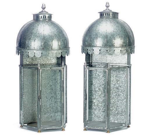 A PAIR OF GLASS AND BEATEN METAL LANTERNS,