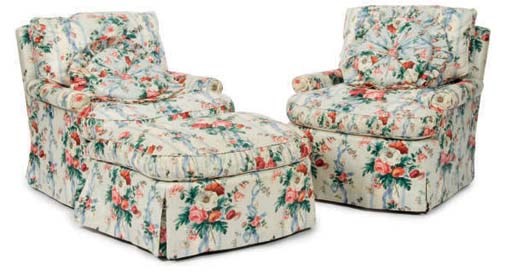 A PAIR OF CHINTZ UPHOLSTERED CLUB CHAIRS AND A MATCHING OTTOMAN,