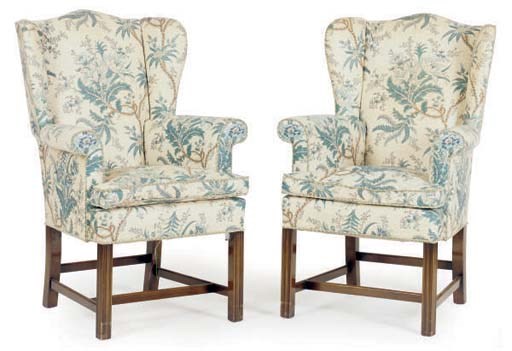 A PAIR OF UPHOLSTERED WING ARMCHAIRS,