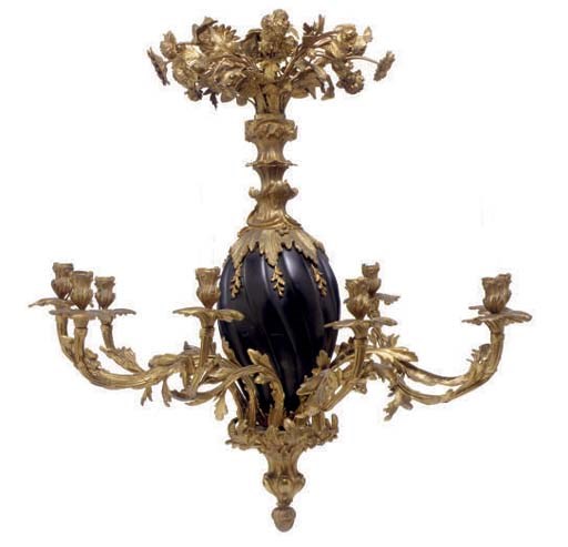 A GILT AND PATINATED-METAL NINE-LIGHT CHANDELIER,
