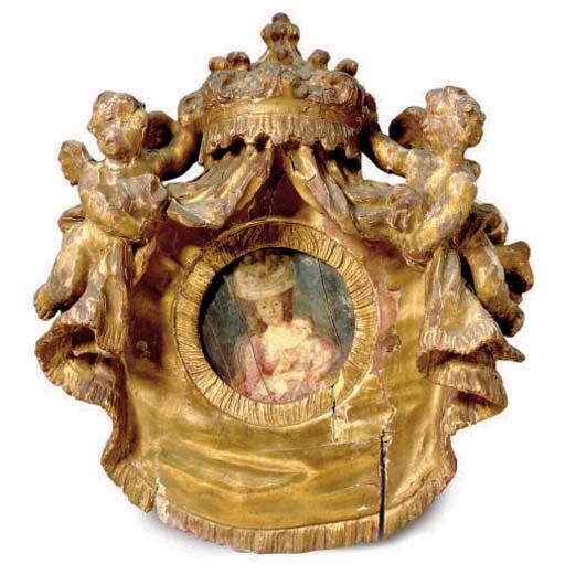 A CARVED GILTWOOD AND BONE CARTOUCHE,