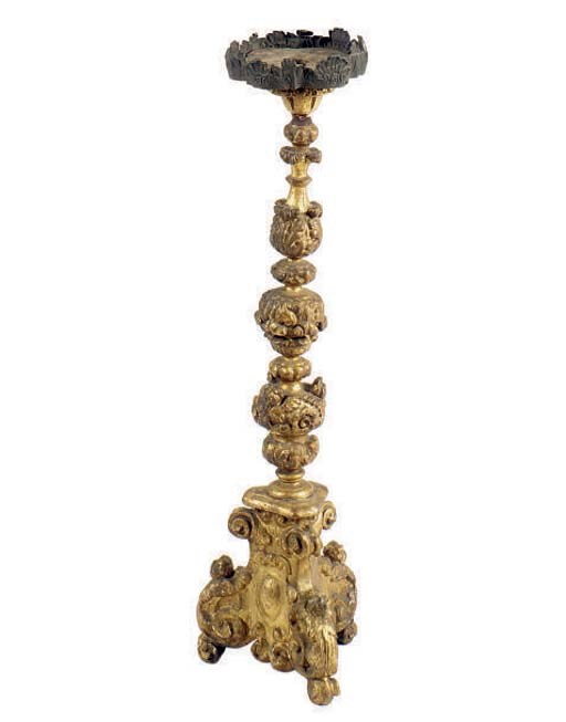 A CARVED GILTWOOD CANDLESTICK,