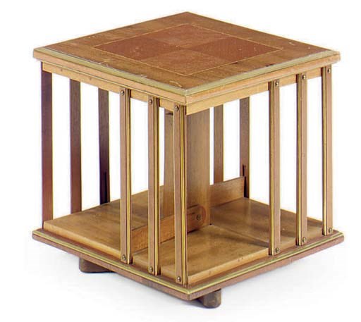 AN ENGLISH BRASS-MOUNTED MAHOGANY REVOLVING CANTERBURY,