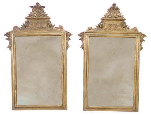 A PAIR OF CARVED GILTWOOD MIRRORS,
