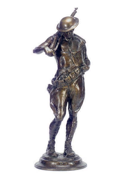 A PATINATED BRONZE FIGURE OF A SOLDIER,