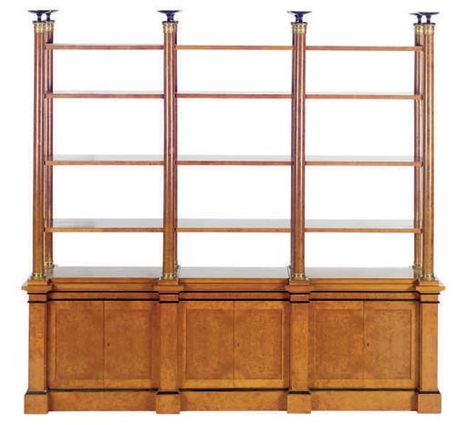A GILT-METAL MOUNTED, BURR BIRCH, AND EBONISED BREAKFRONT BOOKCASE,