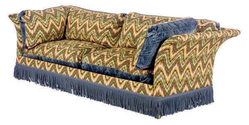 AN UPHOLSTERED BLUE FRINGE SOFA,