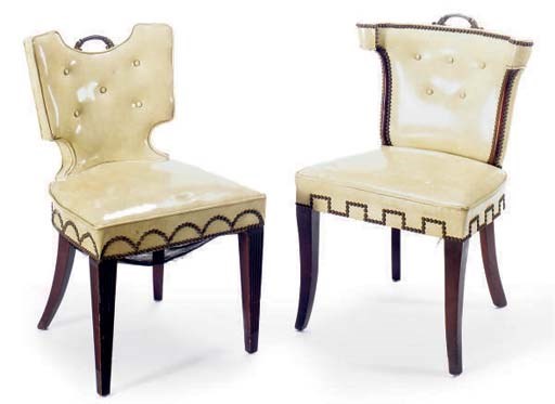 A PAIR OF CREAM VINYL UPHOLSTERED SIDE CHAIRS,