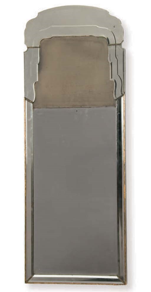 AN EBONISED AND PARCEL-GILT PIER MIRROR,