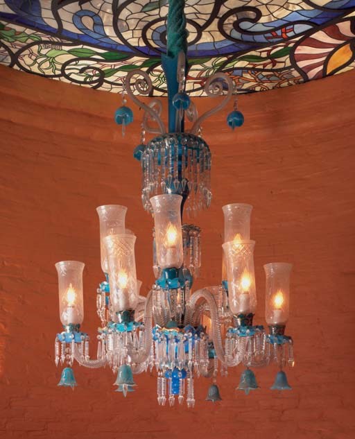A French parcel-gilt turquoise and clear cut glass twelve-light chandelier