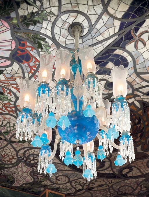 A French parcel-gilt turquoise and clear cut glass twelve-light chandelier