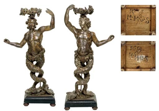 A PAIR OF ITALIAN SILVERED FIGURAL TORCHERES