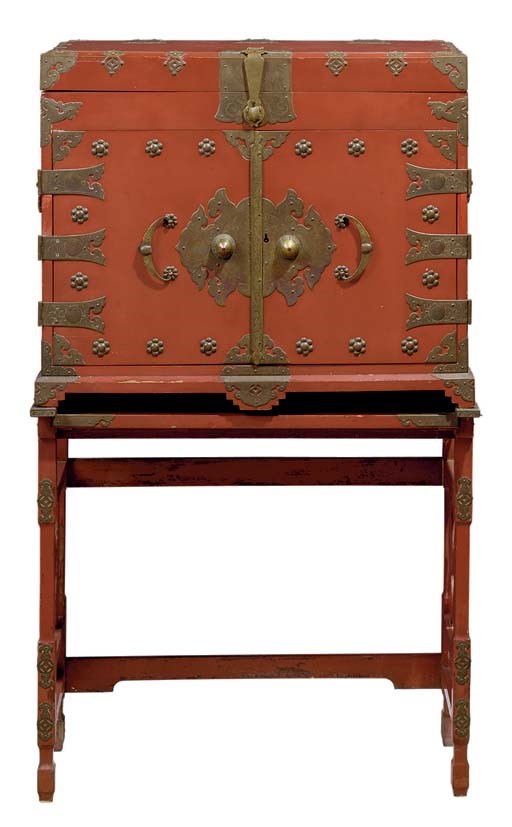 A BRASS-MOUNTED RED-LACQUERED TWO-DOOR CHEST