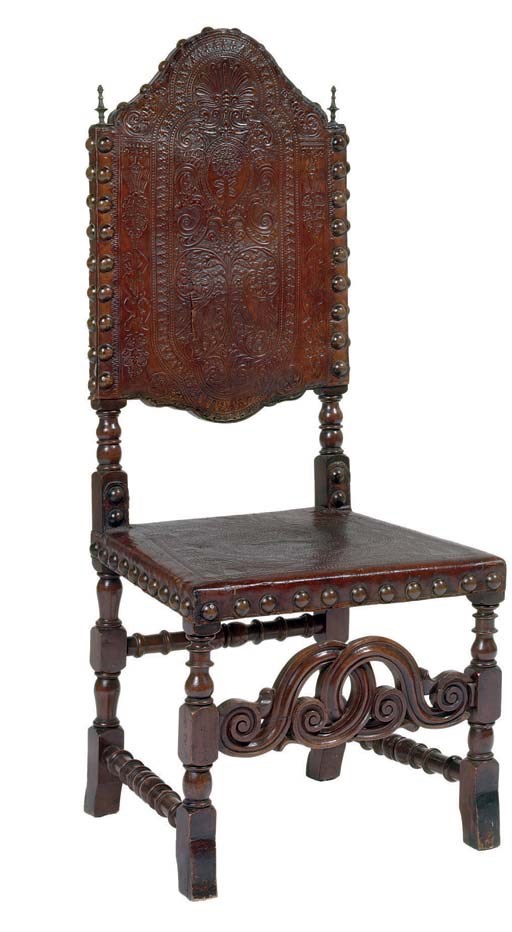 A SET OF EIGHT SPANISH WALNUT AND TOOLED-LEATHER SIDE CHAIRS